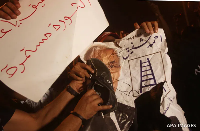 A youth takes part in a demonstration in Tahrir Square to protest the outcome of the Egyptian presidential election, Cairo, Egypt, Monday May 28, 2012. The runoff vote for Egypt's next president will pit the Muslim Broth...