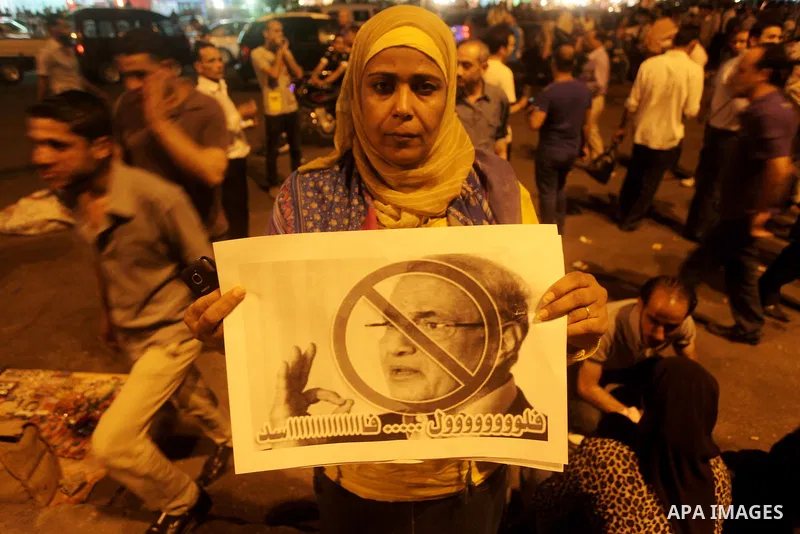 A youth takes part in a demonstration in Tahrir Square to protest the outcome of the Egyptian presidential election, Cairo, Egypt, Monday May 28, 2012. The runoff vote for Egypt's next president will pit the Muslim Broth...