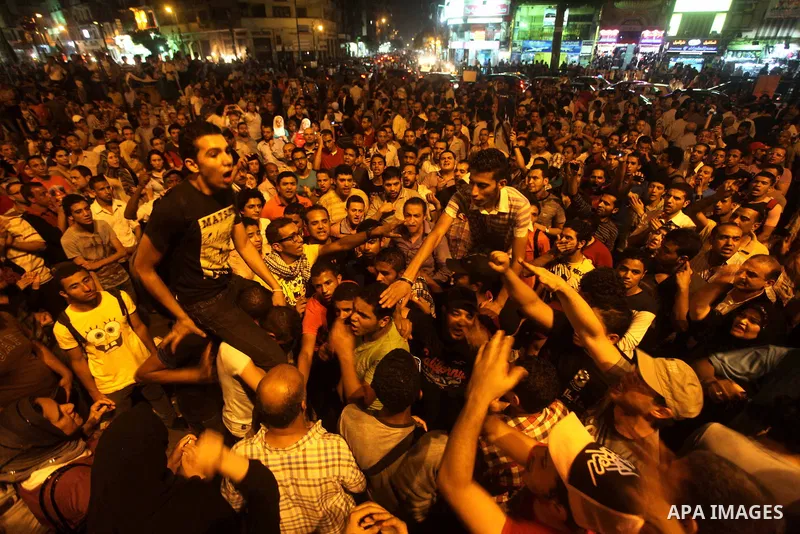 A youth takes part in a demonstration in Tahrir Square to protest the outcome of the Egyptian presidential election, Cairo, Egypt, Monday May 28, 2012. The runoff vote for Egypt's next president will pit the Muslim Broth...