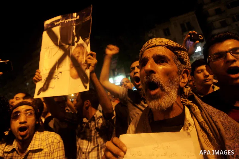 A youth takes part in a demonstration in Tahrir Square to protest the outcome of the Egyptian presidential election, Cairo, Egypt, Monday May 28, 2012. The runoff vote for Egypt's next president will pit the Muslim Broth...