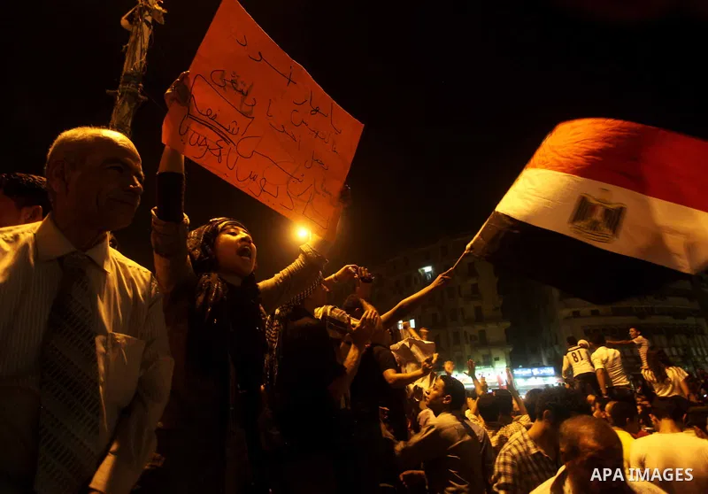 A youth takes part in a demonstration in Tahrir Square to protest the outcome of the Egyptian presidential election, Cairo, Egypt, Monday May 28, 2012. The runoff vote for Egypt's next president will pit the Muslim Broth...