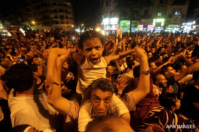 A youth takes part in a demonstration in Tahrir Square to protest the outcome of the Egyptian presidential election, Cairo, Egypt, Monday May 28, 2012. The runoff vote for Egypt's next president will pit the Muslim Broth...