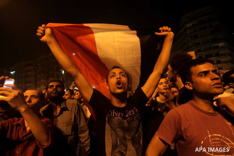 A youth takes part in a demonstration in Tahrir Square to protest the outcome of the Egyptian presidential election, Cairo, Egypt, Monday May 28, 2012. The runoff vote for Egypt's next president will pit the Muslim Broth...