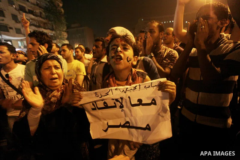 A youth takes part in a demonstration in Tahrir Square to protest the outcome of the Egyptian presidential election, Cairo, Egypt, Monday May 28, 2012. The runoff vote for Egypt's next president will pit the Muslim Broth...