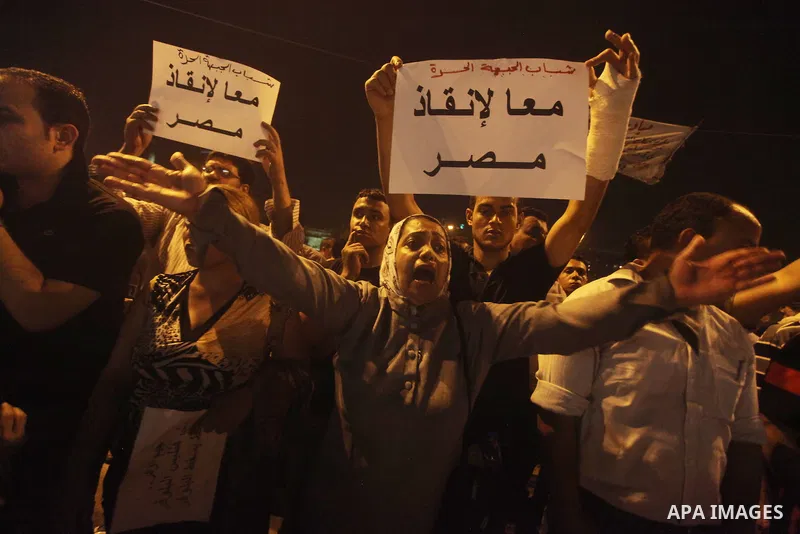 A youth takes part in a demonstration in Tahrir Square to protest the outcome of the Egyptian presidential election, Cairo, Egypt, Monday May 28, 2012. The runoff vote for Egypt's next president will pit the Muslim Broth...