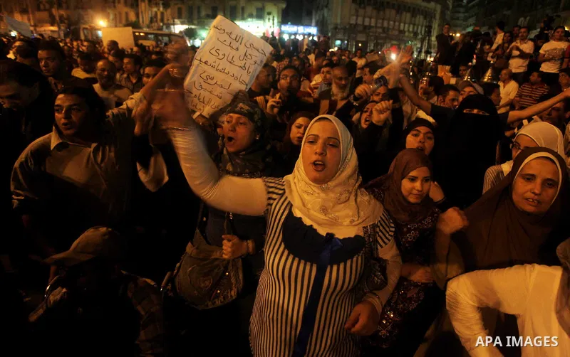 A youth takes part in a demonstration in Tahrir Square to protest the outcome of the Egyptian presidential election, Cairo, Egypt, Monday May 28, 2012. The runoff vote for Egypt's next president will pit the Muslim Broth...
