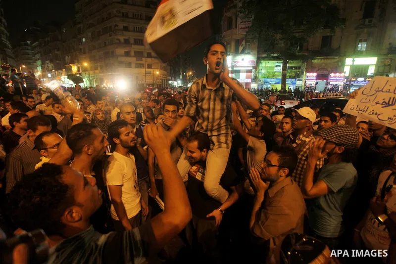 A youth takes part in a demonstration in Tahrir Square to protest the outcome of the Egyptian presidential election, Cairo, Egypt, Monday May 28, 2012. The runoff vote for Egypt's next president will pit the Muslim Broth...