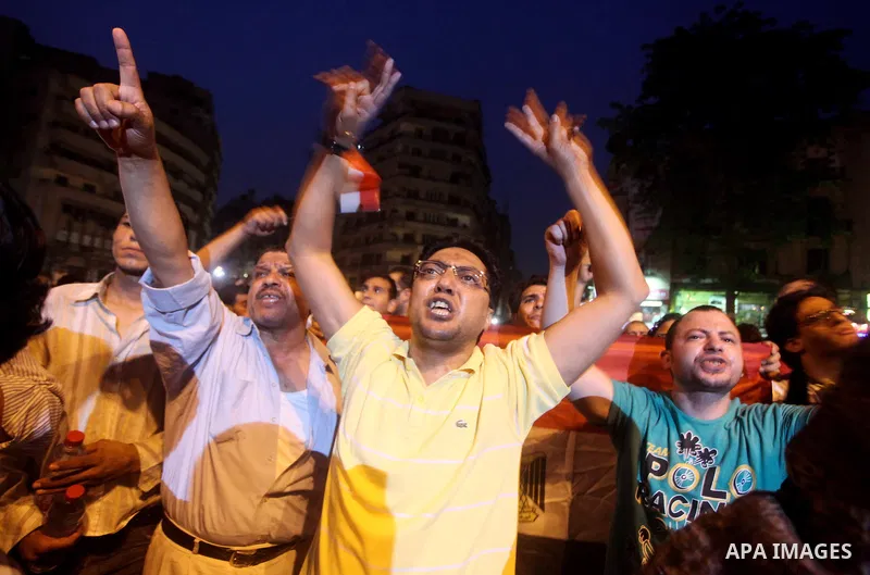 A youth takes part in a demonstration in Tahrir Square to protest the outcome of the Egyptian presidential election, Cairo, Egypt, Monday May 28, 2012. The runoff vote for Egypt's next president will pit the Muslim Broth...
