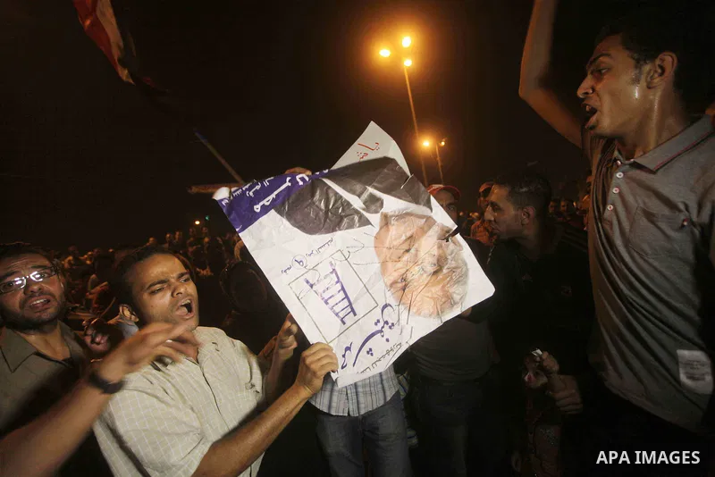 A youth takes part in a demonstration in Tahrir Square to protest the outcome of the Egyptian presidential election, Cairo, Egypt, Monday May 28, 2012. The runoff vote for Egypt's next president will pit the Muslim Broth...