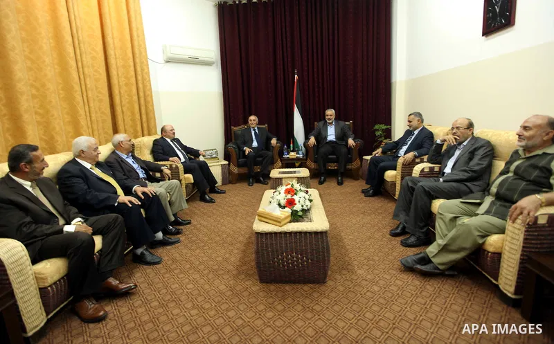 Palestinian prime minister in Gaza Strip, Ismail Haniyeh meets with Munib All-Masri in Gaza City May 29, 2012. Palestinian President Mahmoud Abbas's Fatah faction and Palestinian Islamist group Hamas began talks to form...