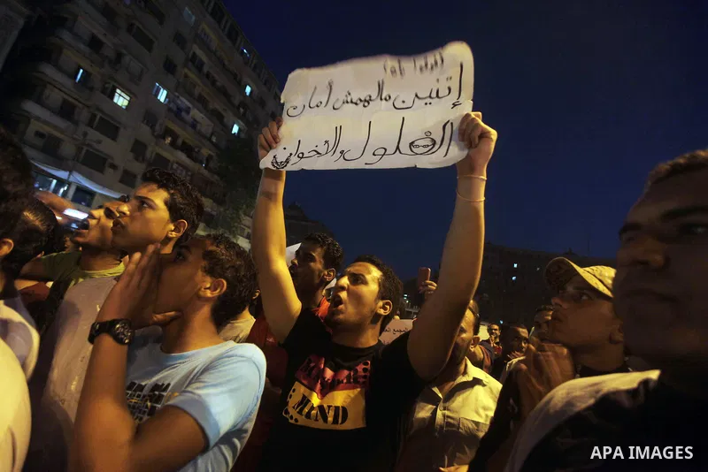 Egyptian protesters attend a demonstration, against presidential candidates Mohammed Morsi and Ahmed Shafiq at Tahrir Square in Cairo May 29, 2012. According to full official results released Monday by the election commi...
