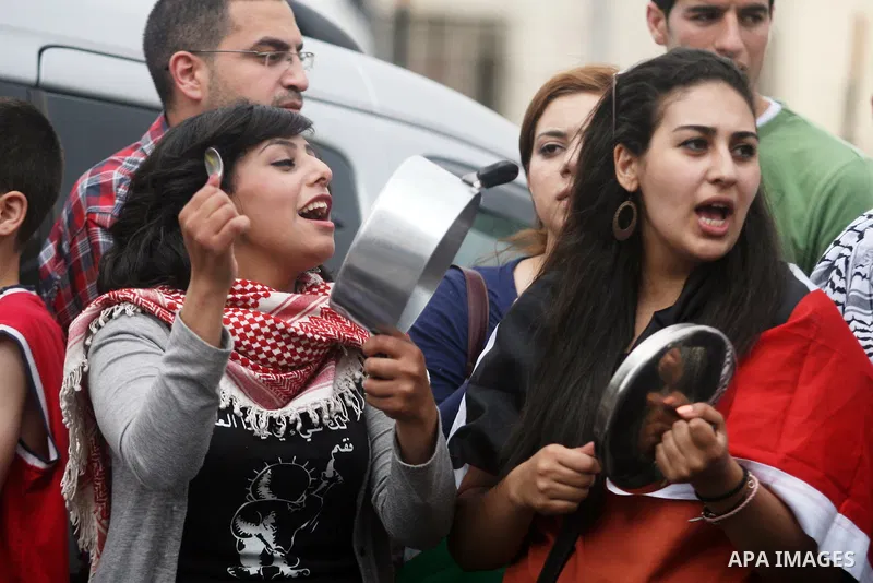 Palestinian protestors bang on pots covered in pictures of Palestinian prisoners Mahmoud al-Sarsak and Akram al-Rikhawi, who are still refusing food a week after a deal was made to end a mass prisoner hunger strike, duri...