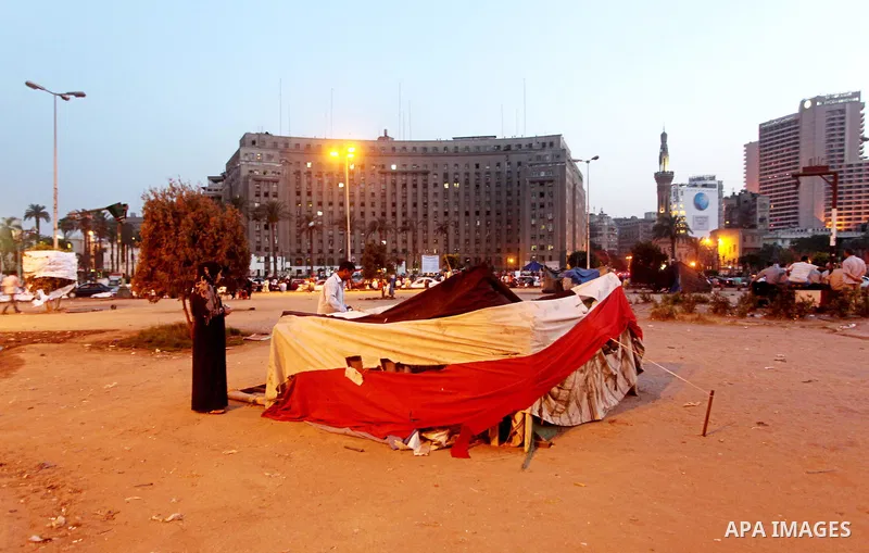 Egyptians gathers during a protest against the results of presidential elections at Tahrir Square, the focal point of the Egyptian uprising, in Cairo, Egypt, May 30, 2012. An arson attack on the headquarters of one of th...