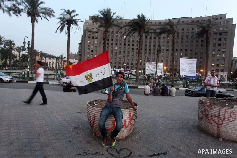 Egyptians gathers during a protest against the results of presidential elections at Tahrir Square, the focal point of the Egyptian uprising, in Cairo, Egypt, May 30, 2012. An arson attack on the headquarters of one of th...