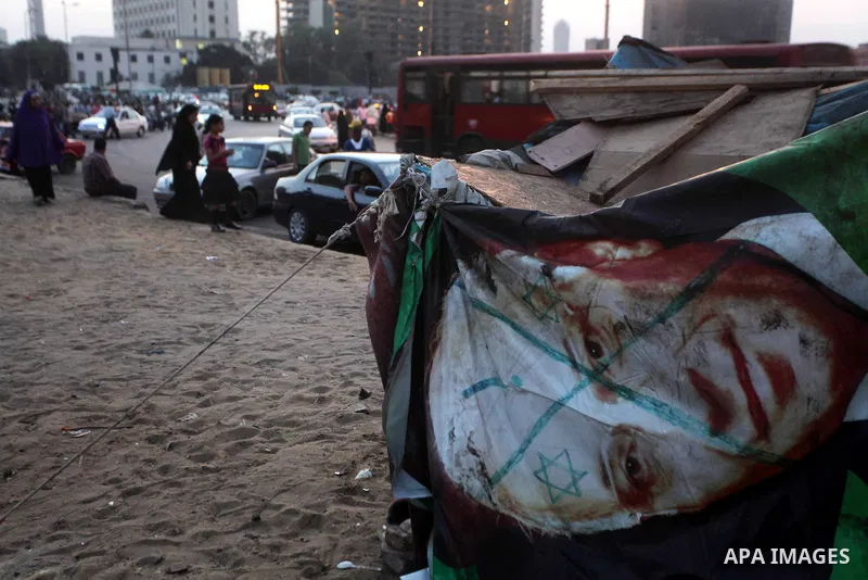 Egyptians gathers during a protest against the results of presidential elections at Tahrir Square, the focal point of the Egyptian uprising, in Cairo, Egypt, May 30, 2012. An arson attack on the headquarters of one of th...