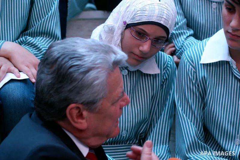 German President Joachim Gauck meets schoolgirls during the inauguration of a new girls school in the West Bank village of Burin, Thursday, May 31, 2012 . Photo by Wagdi Eshtayah