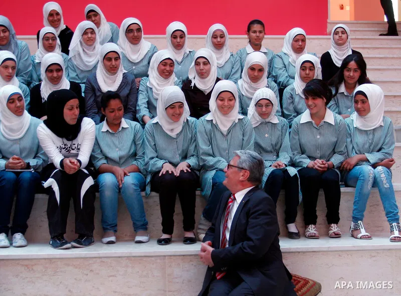 German President Joachim Gauck meets schoolgirls during the inauguration of a new girls school in the West Bank village of Burin, Thursday, May 31, 2012 . Photo by Wagdi Eshtayah