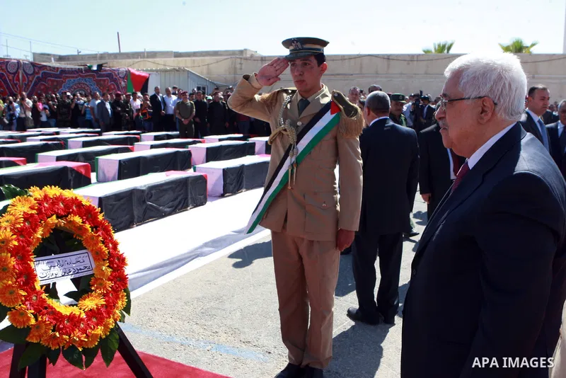Palestinian President Mahmoud Abbas lays a wreath during an official ceremony marking the return of the remains of dozens of Palestinians militants in the West Bank city of Ramallah May 31, 2012. The remains of 91 Palest...