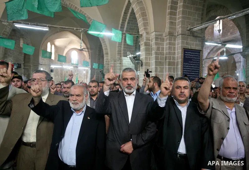 Palestinians pray next to flag-covered coffins containing the remains of Palestinian militants in a mosque in Gaza City May 31, 2012. The remains of 91 Palestinian militants whose attacks killed hundreds of Israelis over...