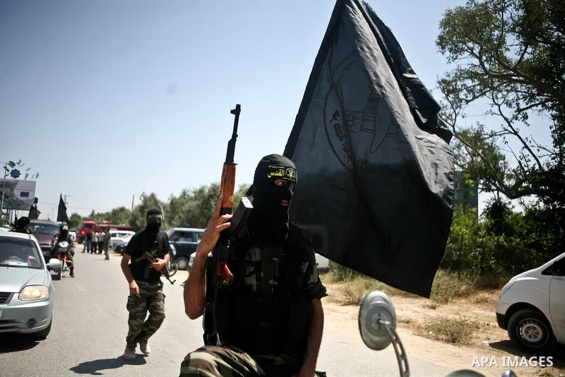 Palestinian Islamic Jihad militants attend the funeral of 12 Palestinian militants transferred from Israel, in Gaza City, Thursday, May 31, 2012. Israel transferred the bodies in an effort to induce Palestinian President...