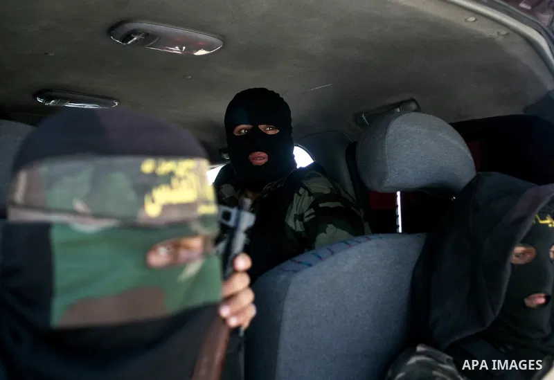 Palestinian Islamic Jihad militants attend the funeral of 12 Palestinian militants transferred from Israel, in Gaza City, Thursday, May 31, 2012. Israel transferred the bodies in an effort to induce Palestinian President...