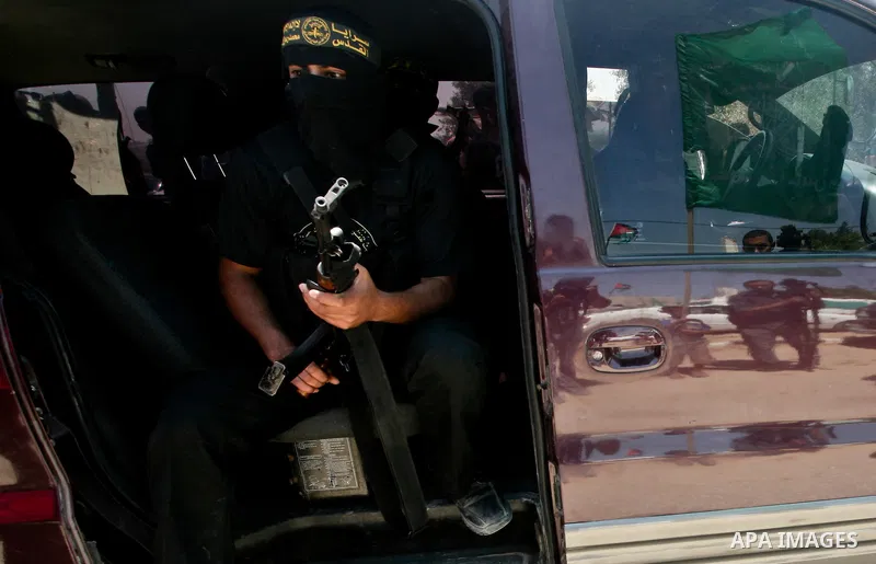 Palestinian Islamic Jihad militants attend the funeral of 12 Palestinian militants transferred from Israel, in Gaza City, Thursday, May 31, 2012. Israel transferred the bodies in an effort to induce Palestinian President...