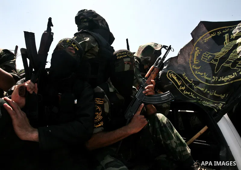 Palestinian Islamic Jihad militants attend the funeral of 12 Palestinian militants transferred from Israel, in Gaza City, Thursday, May 31, 2012. Israel transferred the bodies in an effort to induce Palestinian President...