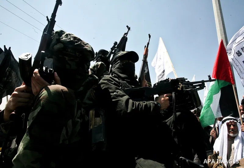 Palestinian Islamic Jihad militants attend the funeral of 12 Palestinian militants transferred from Israel, in Gaza City, Thursday, May 31, 2012. Israel transferred the bodies in an effort to induce Palestinian President...