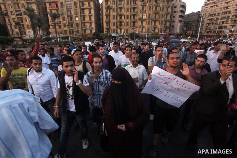 Syrians living in Egypt shout slogans as they protest against the weekend massacre of Houla, in front of the Syrian embassy in Cairo, Egypt, 31 May 2012. A massacre was reported in the central Syrian city of Houla over t...