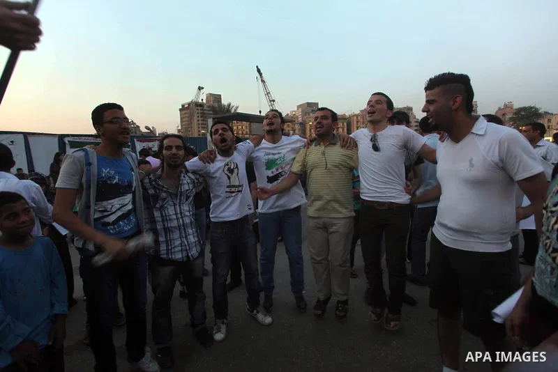 Protesters shout slogans as they protest against the weekend massacre of Houla, in front of the Syrian embassy in Cairo, Egypt, 31 May 2012. A massacre was reported in the central Syrian city of Houla over the weekend, h...