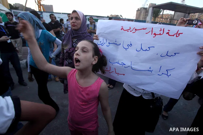 Protesters shout slogans as they protest against the weekend massacre of Houla, in front of the Syrian embassy in Cairo, Egypt, 31 May 2012. A massacre was reported in the central Syrian city of Houla over the weekend, h...