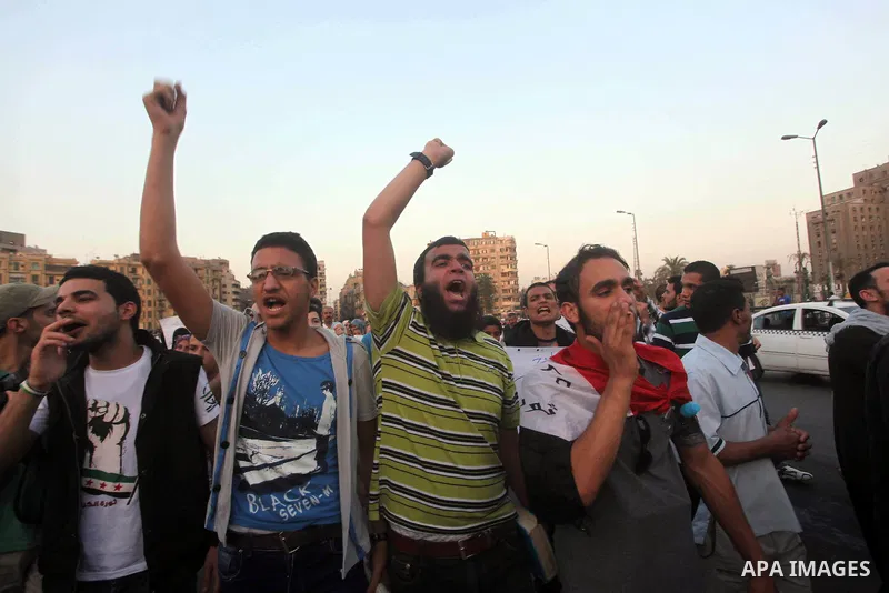 Protesters shout slogans as they protest against the weekend massacre of Houla, in front of the Syrian embassy in Cairo, Egypt, 31 May 2012. A massacre was reported in the central Syrian city of Houla over the weekend, h...