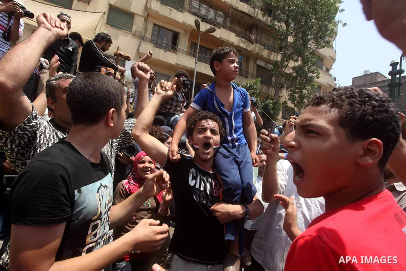 Egyptian protesters hold placards and shout slogans against the presidential candidate Ahmed Shafik, during a protest in Tahrir Square, Cairo, Egypt, 01 June 2012. Media reports state that hundreds of Egyptians held a de...