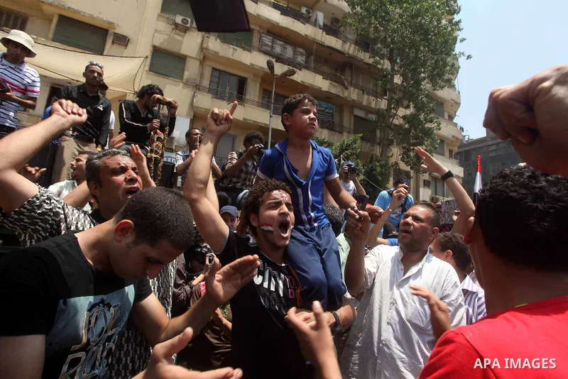 Egyptian protesters hold placards and shout slogans against the presidential candidate Ahmed Shafik, during a protest in Tahrir Square, Cairo, Egypt, 01 June 2012. Media reports state that hundreds of Egyptians held a de...