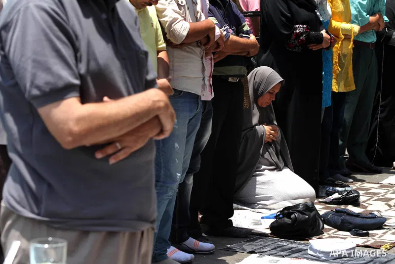 Egyptian protesters perform the weekly Friday noon prayer in Cairo's landmark Tahrir square during a demonstration against Egyptian presidential runoff candidate Ahmed Shafiq, an ex-prime minister under the ousted regime...