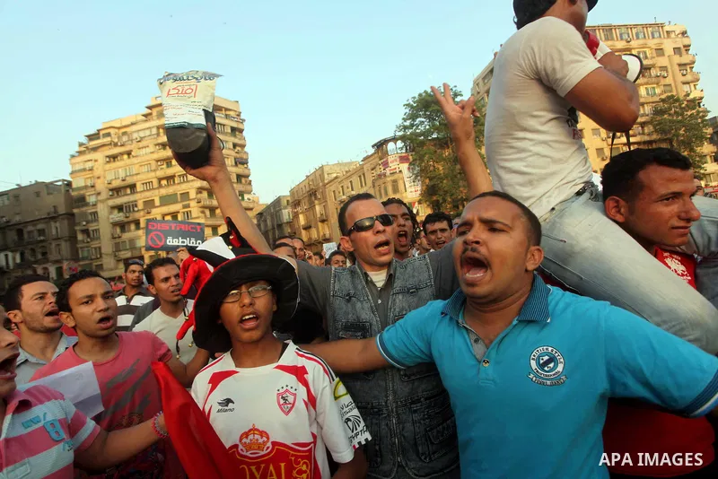 Egyptian protesters chant slogans against Egyptian presidential candidate Ahmed Shafiq in Tahrir Square decrying the result of the first round of voting in the Egyptian presidential election in Cairo, Egypt, Friday, June...