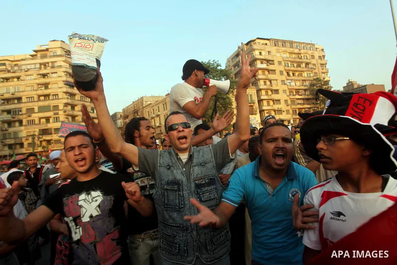 Egyptian protesters chant slogans against Egyptian presidential candidate Ahmed Shafiq in Tahrir Square decrying the result of the first round of voting in the Egyptian presidential election in Cairo, Egypt, Friday, June...
