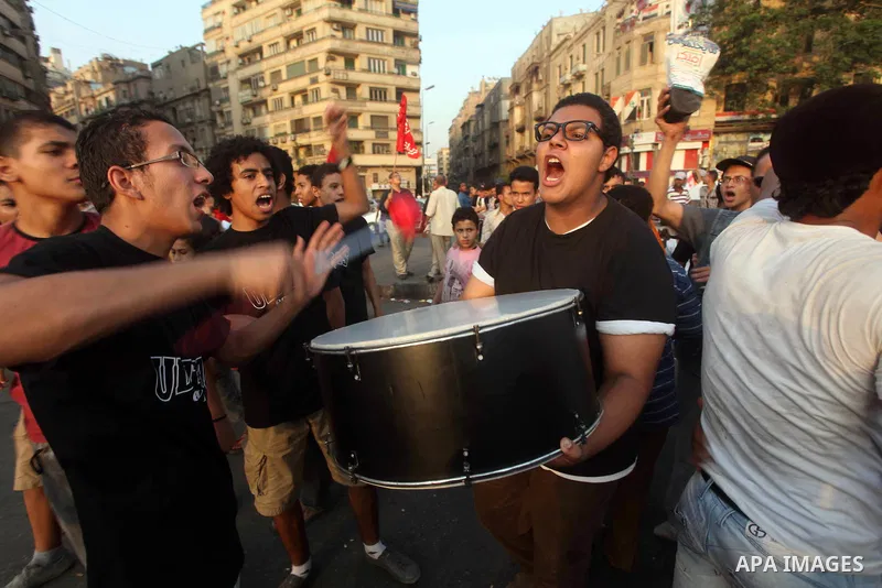 Egyptian protesters chant slogans against Egyptian presidential candidate Ahmed Shafiq in Tahrir Square decrying the result of the first round of voting in the Egyptian presidential election in Cairo, Egypt, Friday, June...