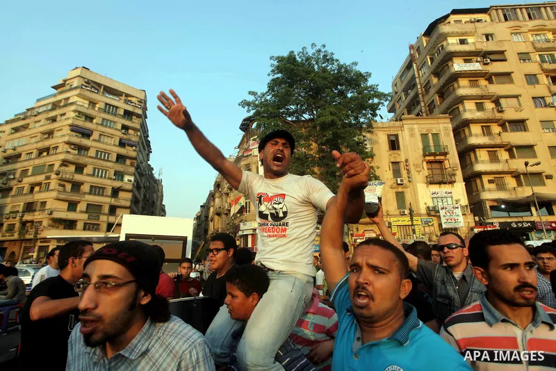 Egyptian protesters chant slogans against Egyptian presidential candidate Ahmed Shafiq in Tahrir Square decrying the result of the first round of voting in the Egyptian presidential election in Cairo, Egypt, Friday, June...