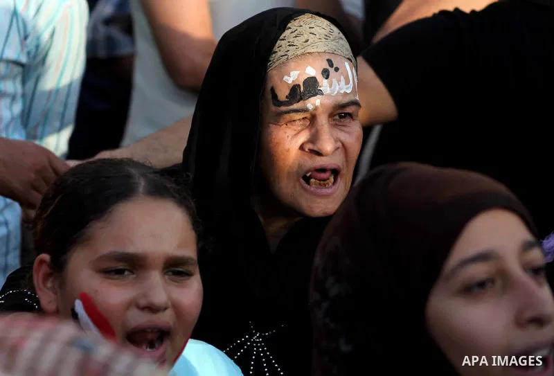 Egyptian protesters chant slogans against Egyptian presidential candidate Ahmed Shafiq in Tahrir Square decrying the result of the first round of voting in the Egyptian presidential election in Cairo, Egypt, Friday, June...