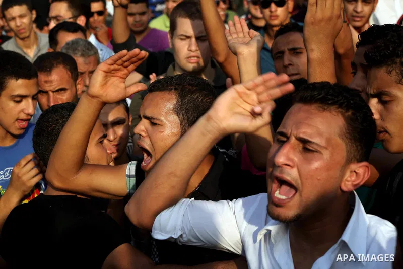 Egyptian protesters chant slogans against Egyptian presidential candidate Ahmed Shafiq in Tahrir Square decrying the result of the first round of voting in the Egyptian presidential election in Cairo, Egypt, Friday, June...
