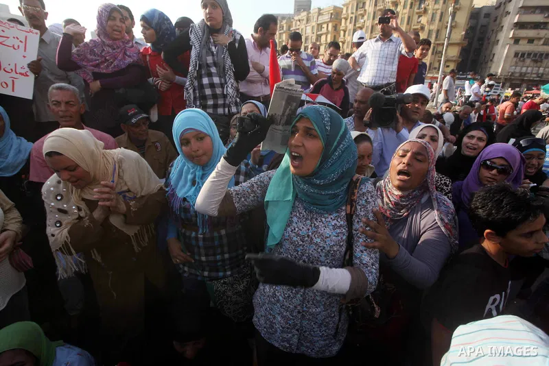 Egyptian protesters chant slogans against Egyptian presidential candidate Ahmed Shafiq in Tahrir Square decrying the result of the first round of voting in the Egyptian presidential election in Cairo, Egypt, Friday, June...