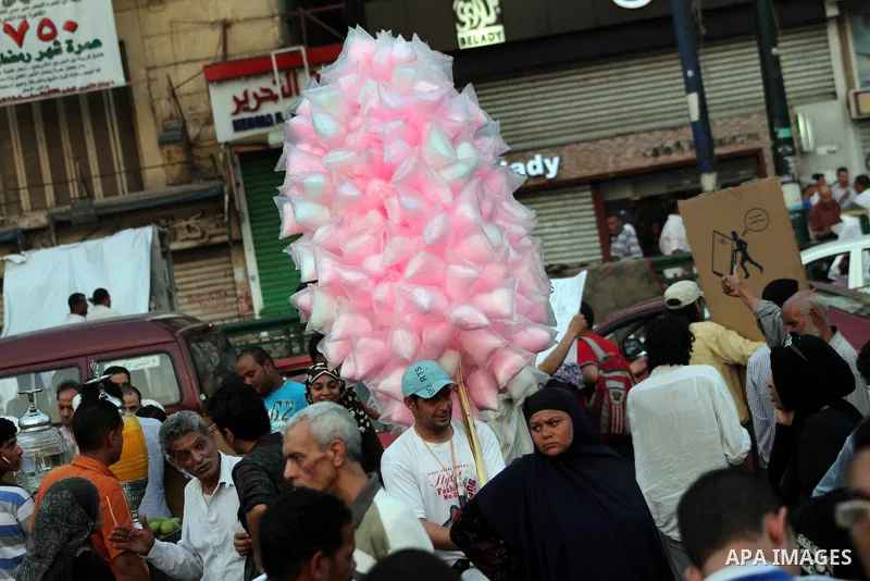 An Egyptian sells sweets during a demonstration against Egyptian presidential candidate Ahmed Shafiq in Tahrir Square decrying the result of the first round of voting in the Egyptian presidential election in Cairo, Egypt...