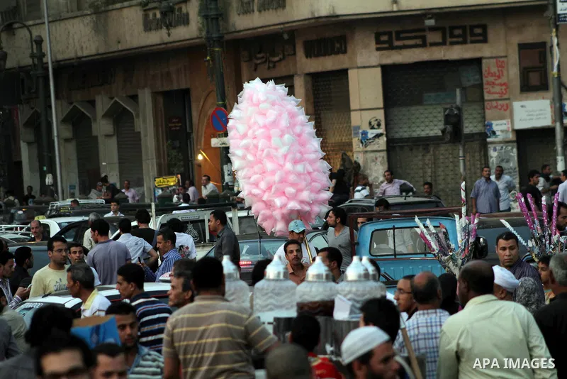 An Egyptian sells sweets during a demonstration against Egyptian presidential candidate Ahmed Shafiq in Tahrir Square decrying the result of the first round of voting in the Egyptian presidential election in Cairo, Egypt...