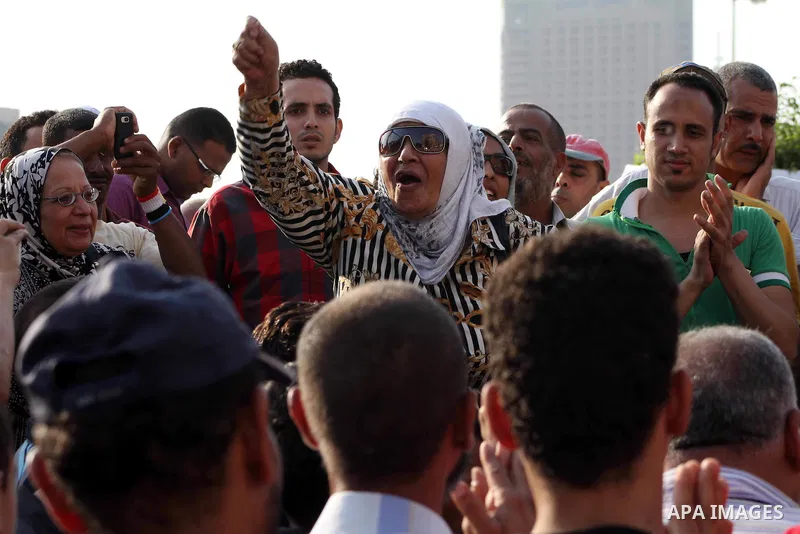 Egyptian protesters chant slogans against Egyptian presidential candidate Ahmed Shafiq in Tahrir Square decrying the result of the first round of voting in the Egyptian presidential election in Cairo, Egypt, Friday, June...
