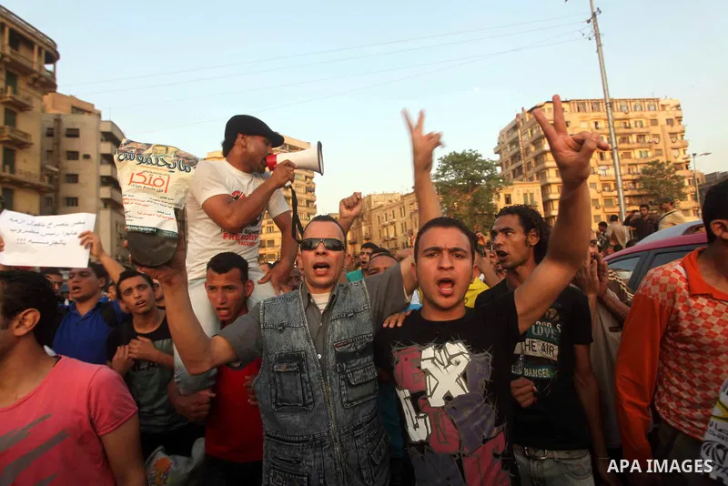 Egyptian protesters chant slogans against Egyptian presidential candidate Ahmed Shafiq in Tahrir Square decrying the result of the first round of voting in the Egyptian presidential election in Cairo, Egypt, Friday, June...