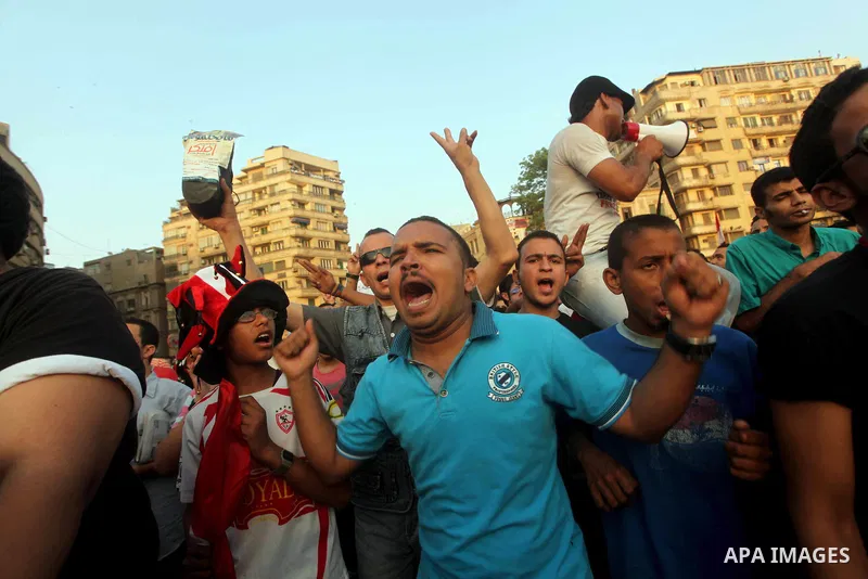 Egyptian protesters chant slogans against Egyptian presidential candidate Ahmed Shafiq in Tahrir Square decrying the result of the first round of voting in the Egyptian presidential election in Cairo, Egypt, Friday, June...