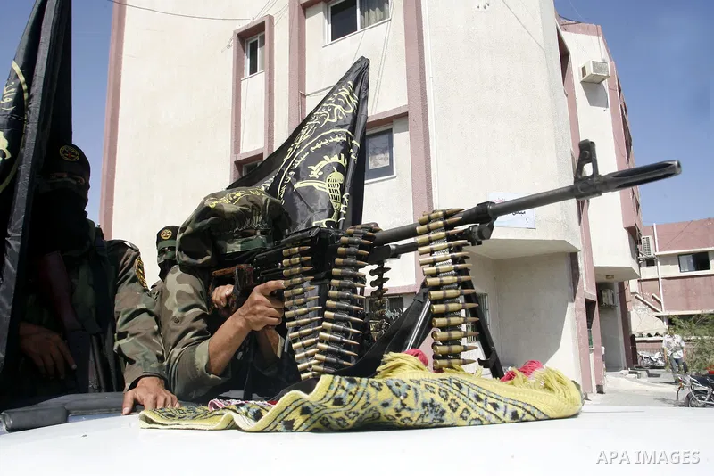 Islamic Jihad militants ride a pick-up truck as they take part in the funeral of Ahmed Nassir in Khan Younis in the southern Gaza Strip June 2, 2012. Palestinian gunman Ahmed Nassir broke into Israel on Friday and killed...