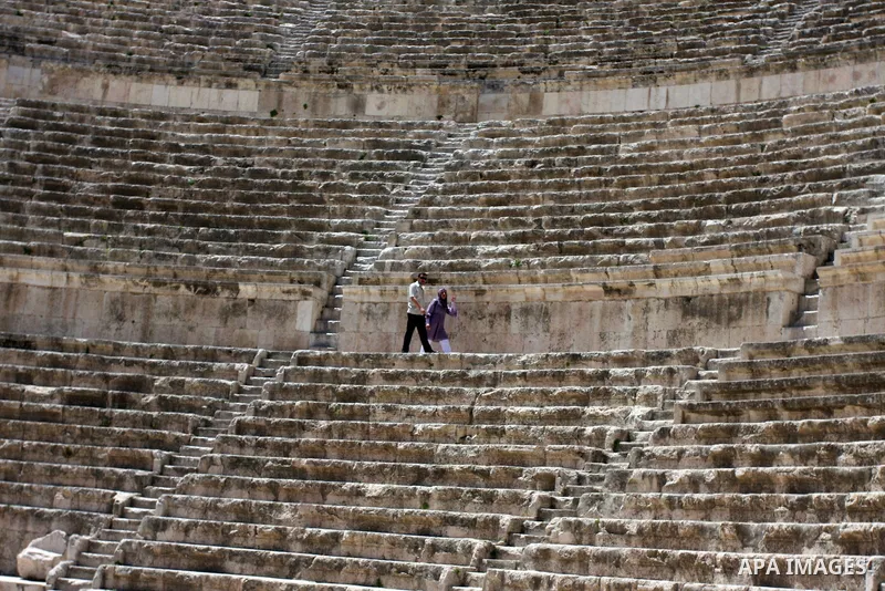 Foreign tourists in the Roman amphitheatre in Amman, Jordan, June 2, 2012. Amphitheatre of the most important Roman monuments in Amman, was built 161 years AD. Photo by Issam Rimawi