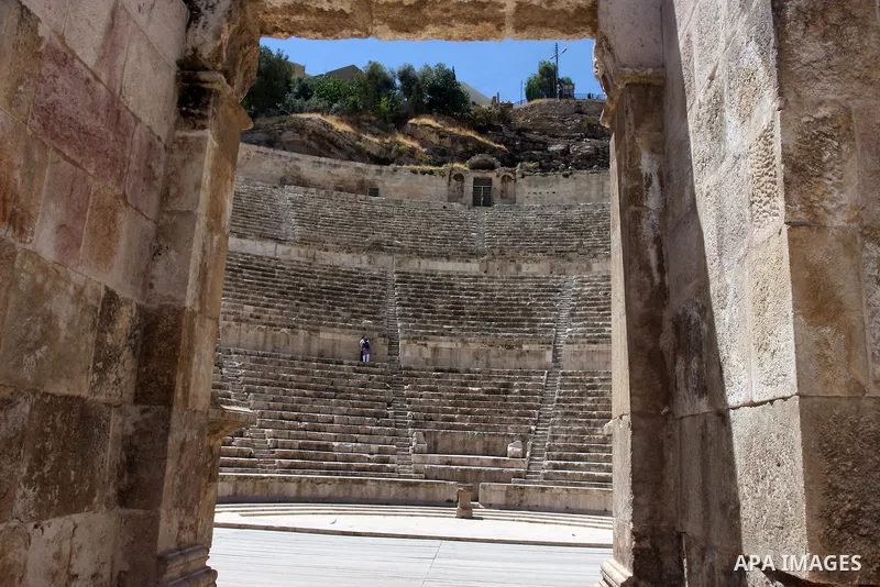 Foreign tourists in the Roman amphitheatre in Amman, Jordan, June 2, 2012. Amphitheatre of the most important Roman monuments in Amman, was built 161 years AD. Photo by Issam Rimawi